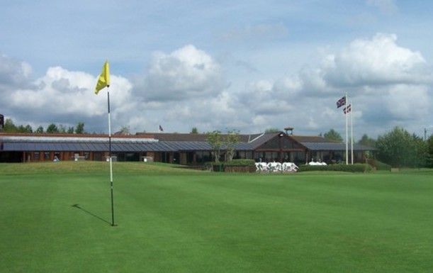 18 Holes for FOUR at Dorset Golf Resort, including a Bacon Roll & Tea or Coffee each.