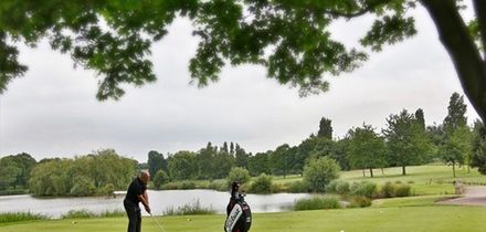 18 Holes of Golf with Bacon Roll and Coffee for Two or Four at Windmill Village Golf and Leisure Club (47% Off)